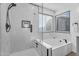 Bright bathroom showcasing a large frameless shower, separate tub, and stylish marble tile surround at 1574 E Scott Ave, Gilbert, AZ 85234
