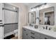 Tastefully remodeled bathroom has double vanities, mirrors, and a shower at 1574 E Scott Ave, Gilbert, AZ 85234