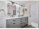 Elegant bathroom featuring a double vanity with quartz countertop, modern fixtures, and white shiplap walls at 1574 E Scott Ave, Gilbert, AZ 85234