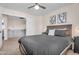 Cozy bedroom with ceiling fan and carpet flooring at 1574 E Scott Ave, Gilbert, AZ 85234