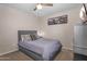 Cozy bedroom with plush bedding, decorative pillows, and soft, natural light at 1574 E Scott Ave, Gilbert, AZ 85234
