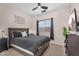 Cozy bedroom with ceiling fan, neutral walls, and carpet flooring at 1574 E Scott Ave, Gilbert, AZ 85234
