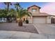 Two-story home with desert landscaping, tile roof, and attached two car garage at 1574 E Scott Ave, Gilbert, AZ 85234