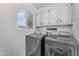 Convenient laundry room features updated washer/dryer and storage at 1574 E Scott Ave, Gilbert, AZ 85234