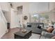 Bright living room featuring high ceilings, ample natural light, and neutral decor at 1574 E Scott Ave, Gilbert, AZ 85234