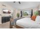 Well-lit primary bedroom with views of the kitchen and backyard at 1574 E Scott Ave, Gilbert, AZ 85234