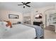 Primary bedroom with ensuite bathroom and views of the kitchen at 1574 E Scott Ave, Gilbert, AZ 85234