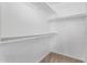 Walk-in closet with white walls, shelving and carpet flooring for storage at 1574 E Scott Ave, Gilbert, AZ 85234