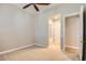 This bedroom features neutral walls and carpet, with access to the en-suite bathroom at 16729 W Alvarado Dr, Goodyear, AZ 85395
