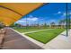Bocce ball courts with shaded seating, offering a leisurely outdoor activity for residents at 16729 W Alvarado Dr, Goodyear, AZ 85395