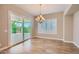 Bright dining room with a sliding glass door that lets in natural light at 16729 W Alvarado Dr, Goodyear, AZ 85395