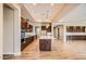 Gourmet kitchen with wood cabinets, large island and stainless steel appliances at 16729 W Alvarado Dr, Goodyear, AZ 85395
