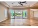 Spacious living room with access to the backyard patio through sliding glass doors at 16729 W Alvarado Dr, Goodyear, AZ 85395