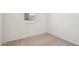 Bright bedroom featuring neutral carpet and a window offering natural light at 18262 W La Senda Dr, Surprise, AZ 85387
