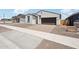 Attractive single-story home featuring a brick driveway and a two-car garage in a suburban neighborhood at 18262 W La Senda Dr, Surprise, AZ 85387
