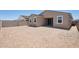 The backyard features a neutral-toned yard at 18268 W La Senda Dr, Surprise, AZ 85387