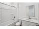 Bright bathroom featuring a shower and tub combination with white cabinets and modern fixtures at 18268 W La Senda Dr, Surprise, AZ 85387