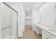 Bright bathroom features a glass-enclosed shower and double vanity sinks at 18268 W La Senda Dr, Surprise, AZ 85387