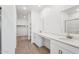 Bright bathroom features a double sink vanity with white cabinets and modern fixtures at 18268 W La Senda Dr, Surprise, AZ 85387