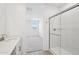 Modern bathroom boasts a glass shower and views into the adjacent bedroom at 18268 W La Senda Dr, Surprise, AZ 85387