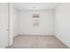 Carpeted bedroom with large window provides plenty of natural light at 18268 W La Senda Dr, Surprise, AZ 85387