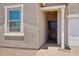 Bright and airy entry with a stylish dark door leading to interior rooms at 18268 W La Senda Dr, Surprise, AZ 85387