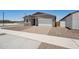 Well-maintained single story home boasts a two-car garage, low maintenance yard, and neutral color palette at 18268 W La Senda Dr, Surprise, AZ 85387