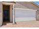Inviting single story home features a covered entry way, paved driveway and two-car garage at 18268 W La Senda Dr, Surprise, AZ 85387