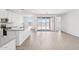 Contemporary kitchen features white cabinets, stainless steel appliances, tile backsplash, and an open layout at 18268 W La Senda Dr, Surprise, AZ 85387