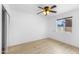 Bedroom with hardwood floors, a sliding door closet, and a ceiling fan at 2002 W Windrose Dr, Phoenix, AZ 85029