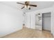 Bedroom with hardwood floors, a sliding door closet, and a view of the backyard at 2002 W Windrose Dr, Phoenix, AZ 85029