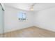 Bright bedroom with a ceiling fan, light wood floors, and a sliding door closet at 2002 W Windrose Dr, Phoenix, AZ 85029