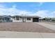 Charming single-story home with solar panels, a gravel yard, and a covered carport at 2002 W Windrose Dr, Phoenix, AZ 85029