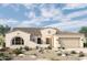 Beautiful single-story home boasting a two-car garage and a well-manicured desert landscape at 20221 W San Juan Ave, Litchfield Park, AZ 85340
