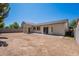 Large backyard area with a block wall and a covered patio, perfect for creating an outdoor oasis at 2024 W Darrel Rd, Phoenix, AZ 85041