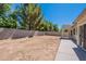 Large backyard area with a block wall and a covered patio, perfect for creating an outdoor oasis at 2024 W Darrel Rd, Phoenix, AZ 85041