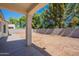 A large backyard with a covered patio and a block wall, offering a private and spacious outdoor area at 2024 W Darrel Rd, Phoenix, AZ 85041