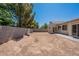 A large backyard with a block wall and a covered patio, perfect for outdoor activities and relaxation at 2024 W Darrel Rd, Phoenix, AZ 85041