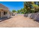 View of the back exterior with a covered patio, large sliding doors and potential for outdoor living at 2024 W Darrel Rd, Phoenix, AZ 85041