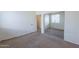 Bedroom with a mirrored closet, neutral walls, and carpet at 2024 W Darrel Rd, Phoenix, AZ 85041