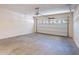Spacious garage with concrete floors and white walls, plus an automatic door and room for storage at 2024 W Darrel Rd, Phoenix, AZ 85041