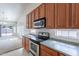 Bright kitchen with stainless steel appliances and updated countertops, perfect for any home chef at 2024 W Darrel Rd, Phoenix, AZ 85041