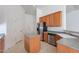Modern kitchen boasting stainless steel appliances, updated countertops, and a functional island for prep at 2024 W Darrel Rd, Phoenix, AZ 85041