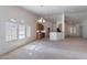 Open-concept living room flows into kitchen, creating a perfect space for entertaining with ample natural light at 2024 W Darrel Rd, Phoenix, AZ 85041