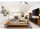 Bright, open living room features a modern gray sectional, built-in entertainment center, and marble floors at 2301 E Sunnyside Dr, Phoenix, AZ 85028