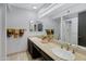 Bathroom featuring a dual sink vanity with a large mirror and great lighting at 3106 S Extension Rd, Mesa, AZ 85210