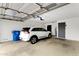 Attached garage featuring ample space, a car, and a secure door for convenient and safe parking at 3106 S Extension Rd, Mesa, AZ 85210