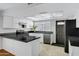 Stylish kitchen featuring white cabinets, stainless steel appliances, and modern countertops at 3106 S Extension Rd, Mesa, AZ 85210