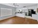 Eat-in kitchen features white cabinets, black countertops and stainless appliances at 3106 S Extension Rd, Mesa, AZ 85210