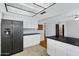 Well-lit kitchen features updated appliances, countertops and white cabinets at 3106 S Extension Rd, Mesa, AZ 85210
